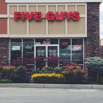 Five Guys - Side entrance and patio seating - Burgers Near Me - Amherst, New York