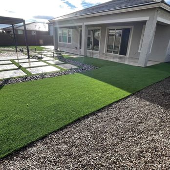 Ironhand Hardscape - a backyard with artificial grass - Artificial Turf Near Me