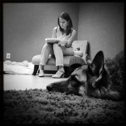 Cafe of Life - April takes notes after working on Sasha, the elderly GSD.