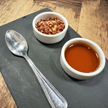 Razza - House chili oil and crushed red pepper flakes - Pizza Near Me - Jersey City, New Jersey Razza - House chili oil and crushed red pepper flakes - Pizza Near Me - Jersey City, New Jersey