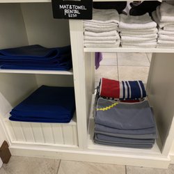 Mat and towel rental area for yoga studio