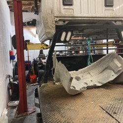 Modern Diesel Repair And Performance - Lifted cab off truck to replace back timing cover gasket.
