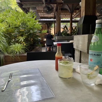 Lure - View from my seat on the patio. It was warm but the fans cooled you down. In the back is the Caipirinha cocktail. - Seafood Near Me - Atlanta, Georgia Lure - View from my seat on the patio. It was warm but the fans cooled you down. In the back is the Caipirinha cocktail. - Seafood Near Me - Atlanta, Georgia