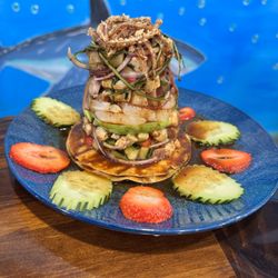 Mariscos El Marinero - Tostada La FRESITA. (Strawberry, tuna, mahi-mahi, raw shrimp, cooked shrimp, octopus, cucumber & onions). With special sauce.