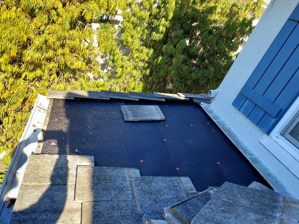 Slide of Huertas roofing