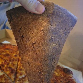 DC Slices - a hand holding a piece of pizza - Pizza Near Me DC Slices - a hand holding a piece of pizza - Pizza Near Me