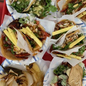 Photo of Tacos El Gordo - Chula Vista, CA, United States. Lengua, Cabeza (Upper Left) , Al Pastor + Pineapple (Middle) , and Vampiro (Bottom right)