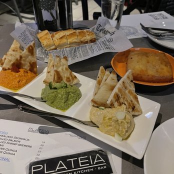 Plateia Mediterranean Kitchen Bar - Hummus Trio. Saganaki and fresh bread - Bars Near Me - Glenview, Illinois Plateia Mediterranean Kitchen Bar - Hummus Trio. Saganaki and fresh bread - Bars Near Me - Glenview, Illinois