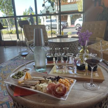 Evoke Winery - Big daddy charcuterie board (already half eaten because we were hungry), red wine tasting, and Oh! Orgasmic tasting. - Wine Tasting Room Near Me - Bend, Oregon