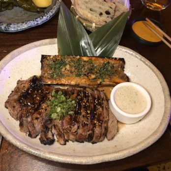 Marion - 12 oz. Ribeye with Bone Marrow off a halved femur - Mediterranean Near Me - Miami, Florida Marion - 12 oz. Ribeye with Bone Marrow off a halved femur - Mediterranean Near Me - Miami, Florida