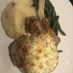 Unflavorful Pork Chop topped with Bleu Cheese