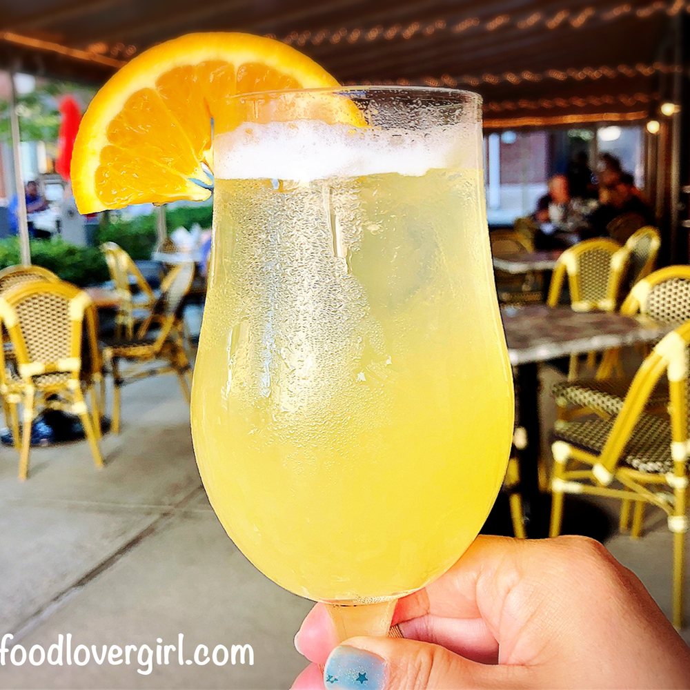 Trevi Cafe & Wine Bar - a person holding a glass of lemonade - Wine Bars Near Me - Mashpee, Massachusetts Trevi Cafe & Wine Bar - a person holding a glass of lemonade - Wine Bars Near Me - Mashpee, Massachusetts