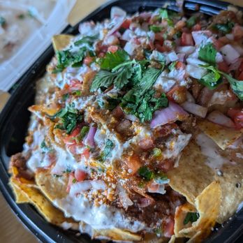 Foreign Exchange Brewing - It's not a pretty photo but these are the incredible birria nachos. - Brewpubs Near Me - Aurora, Illinois