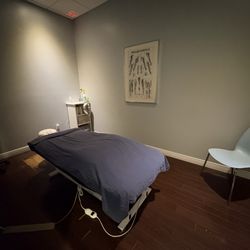 New West Wellness Centre - Massage therapy Room with dimmable lights for calm environment and heated table to relieve pain and stiffness, increase relaxation.