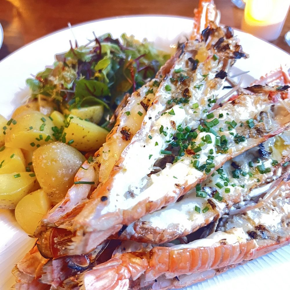 Langoustine with roasted potatoes and vegetables.