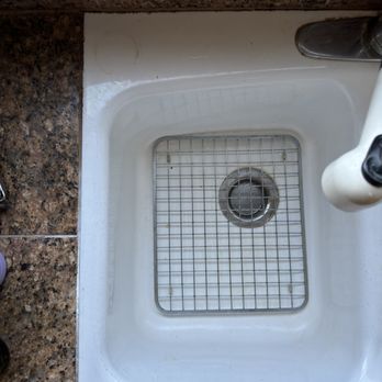 Cool Service - Old white cast iron sink grouted in with surrounding granite tiles. - Plumbing Near Me - Los Gatos, California
