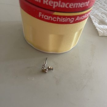One Stop Nutrition - Earring next to the cup it was in - Juice Bars & Smoothies Near Me - Mesa, Arizona