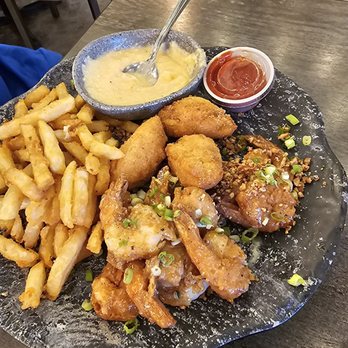 Wharf Casual Seafood - Honey pecan shrimp, fries, hushpuppies and Smoked Gouda Cheese grits. - Seafood Near Me - Tallahassee, Florida Wharf Casual Seafood - Honey pecan shrimp, fries, hushpuppies and Smoked Gouda Cheese grits. - Seafood Near Me - Tallahassee, Florida
