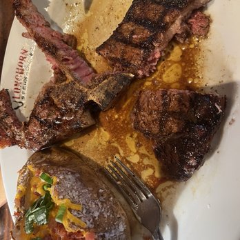 LongHorn Steakhouse - Loaded backed potato and half of each steak. - Steakhouses Near Me - Cheektowaga, New York LongHorn Steakhouse - Loaded backed potato and half of each steak. - Steakhouses Near Me - Cheektowaga, New York