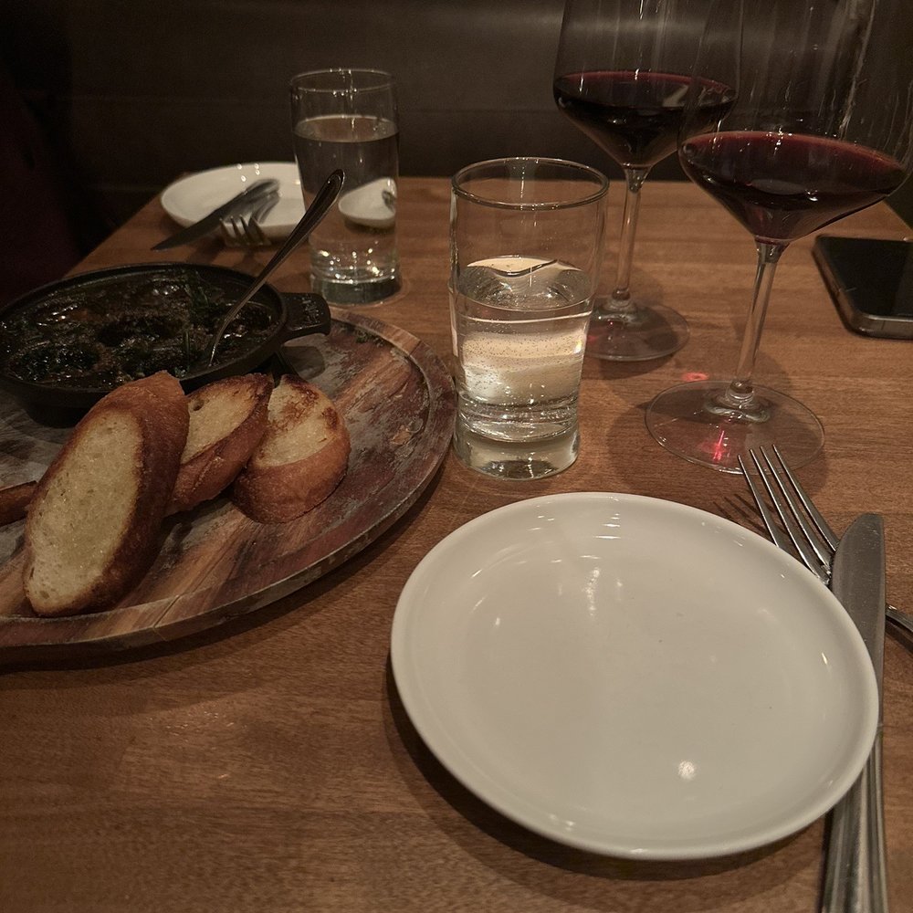 Boeufhaus - Escargot with bread and wine. - Brasseries Near Me - Chicago, Illinois Boeufhaus - Escargot with bread and wine. - Brasseries Near Me - Chicago, Illinois