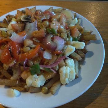 Taps Brewhouse - Vegetarian curry poutine. - Pubs Near Me - Niagara Falls, Ontario Taps Brewhouse - Vegetarian curry poutine. - Pubs Near Me - Niagara Falls, Ontario