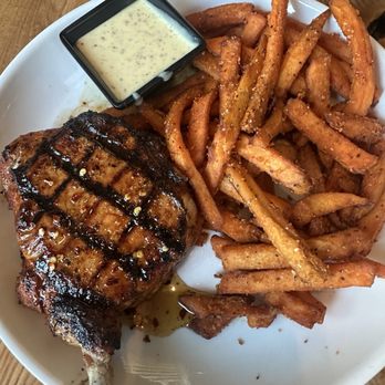 Roots Seasonal Cuisine - Grilled pork chop - New American Near Me - Lee's Summit, Missouri