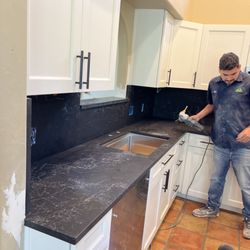 Tucson Cabinets and Stoneworks - Cleaning up after install