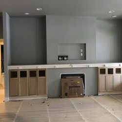 MR Coatings - Custom built in cabinets with mantle shelf before painting
