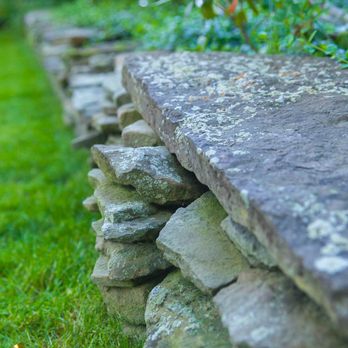Lawn Gevity Landscaping - a stone wall in a garden - Lawn Services Near Me - Toms River, New Jersey Lawn Gevity Landscaping - a stone wall in a garden - Lawn Services Near Me - Toms River, New Jersey