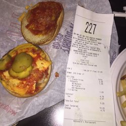The wrong fixings on my burger with the receipt, that shows what I asked for, next to the burger !