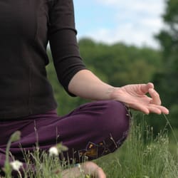 Central Mass Yoga And Wellness - Meditating next to Wachusett Reservoir where CMYW is located.