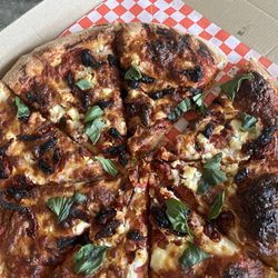 Odyssey Pizzeria Taqueria - Burned top & bottom. Note the "extra paid for toppings " that aren't there!