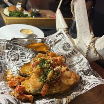 Deluxe Fun Dining - Lobster and shrimp loaded baked potato - Bars Near Me - Charlotte, North Carolina Deluxe Fun Dining - Lobster and shrimp loaded baked potato - Bars Near Me - Charlotte, North Carolina