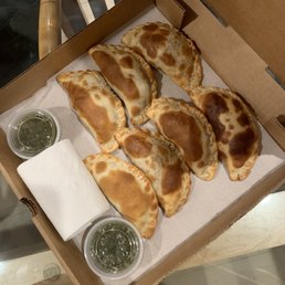 Assorted empanadas with chimichurri