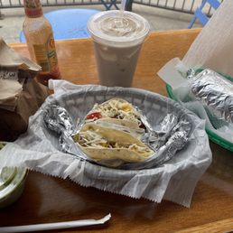 Two tacos, chips and guacamole, a burrito, horchata. Two tacos, chips and guacamole, a burrito, horchata.