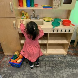 Cypress Library - The kids love this little kitchen play area! So many toy foods for the kids to practice saying.