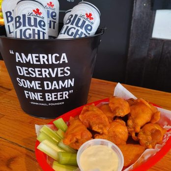Wayside Inn - a basket of chicken wings and a cup of beer - New American Near Me - Mannsville, New York Wayside Inn - a basket of chicken wings and a cup of beer - New American Near Me - Mannsville, New York