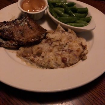 The Chop House - Petite pork-chops with sugar snap pees, mashed potatoes and baked apples. - Steakhouses Near Me - Murfreesboro, Tennessee