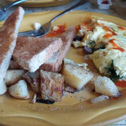 Spinach, Feta and Olive omelette with hot sauce, home fries and toast.
