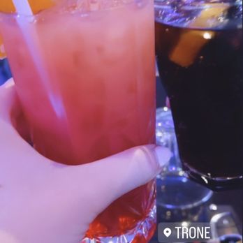Trône - a person holding a drink with a straw - Bars Near Me - Montreal, Quebec Trône - a person holding a drink with a straw - Bars Near Me - Montreal, Quebec