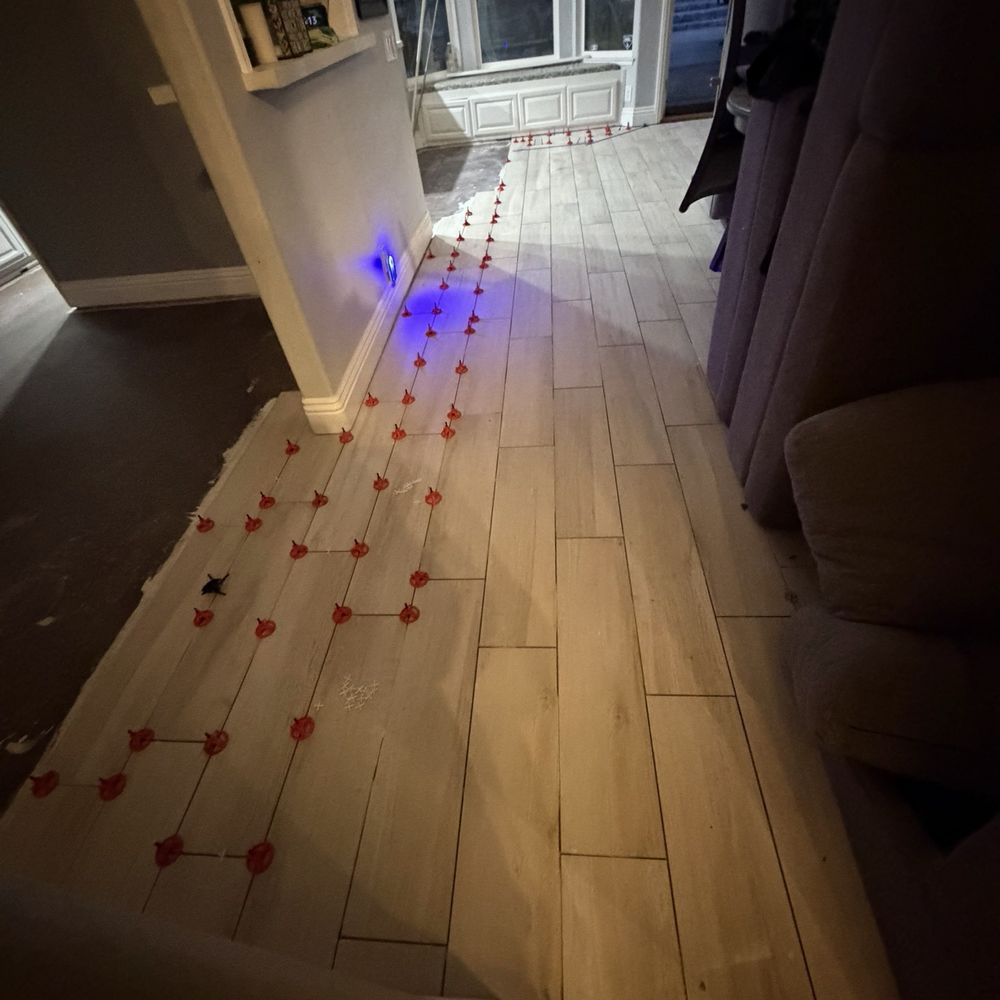 Elegante Tile Designs - In process laying tile over raised floor. - Tiling Near Me Elegante Tile Designs - In process laying tile over raised floor. - Tiling Near Me