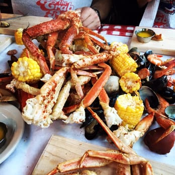 The Crab Pot - Snow crab legs and mixed seafood we ordered. All dishes come with corn, potatoes, and bread. - Seafood Near Me - Seattle, Washington The Crab Pot - Snow crab legs and mixed seafood we ordered. All dishes come with corn, potatoes, and bread. - Seafood Near Me - Seattle, Washington