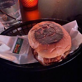 Lakeside Lounge - a hamburger on a plate with a glass of water - Sports Bars Near Me - Nashville, Tennessee Lakeside Lounge - a hamburger on a plate with a glass of water - Sports Bars Near Me - Nashville, Tennessee