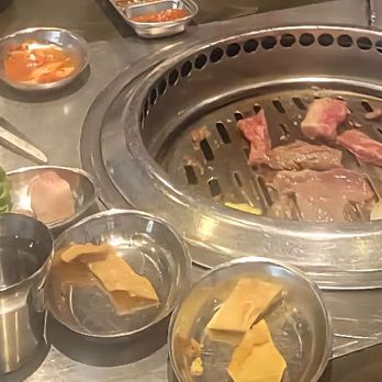 Tomukun Korean Barbeque - I got excited about the food & took the picture late--thick ribeye steaks, generous portions of marinated ribeye and marinated short rib. - Korean Near Me - Ann Arbor, Michigan
