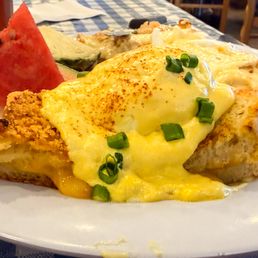 Parmesan-crusted grilled cheese benedict. Parmesan-crusted grilled cheese benedict.