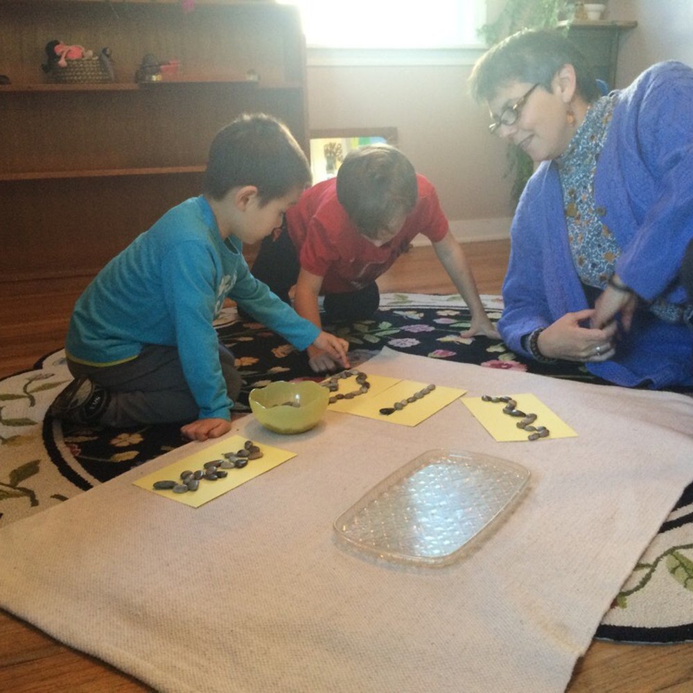 Veranda Montessori School - Teacher is giving a lesson. - Montessori Schools Near Me - Seattle, Washington Veranda Montessori School - Teacher is giving a lesson. - Montessori Schools Near Me - Seattle, Washington