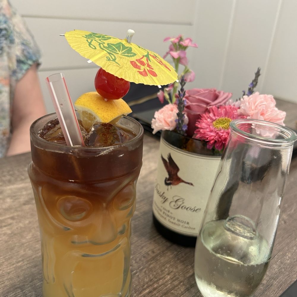 FOR custom Mai Tai.  Fresh flowers on the table, and a small stemless flute of prosecco.  Great start to our evening.