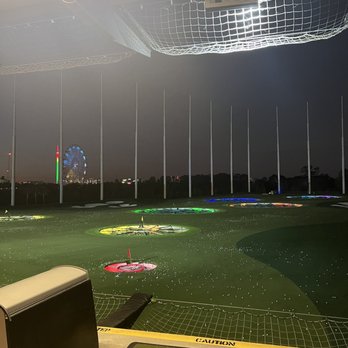 Topgolf - top golf range/view at night - New American Near Me - Orlando, Florida Topgolf - top golf range/view at night - New American Near Me - Orlando, Florida