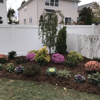 Sal & Tony's Landscaping - a flower bed in front of a house - Landscaping Near Me - Staten Island, New York