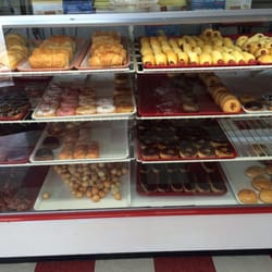 Donut Palace - Hardly a palace, but they deliver on the claim of hot, fresh donuts & colaches.